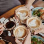 Enjoying delicious coffee with friends, perfect morning moment.
